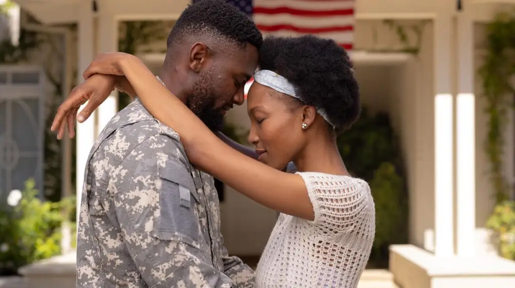 Military couple sharing intimate vows during an at-home online wedding